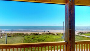 A wooden deck with a view of the beach and ocean. - 7 Day Weekend: 4  BR, 3  BA House in Crystal Beach, Sleeps 17 (Bolivar Peninsula)