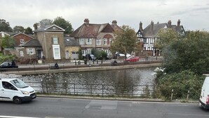 A residential street with houses, a canal, and parked cars. - South London Single Bedroom in Mitcham (Mitcham)