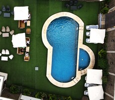 Outdoor pool, open 10:00 AM to 7:00 PM, pool umbrellas, sun loungers