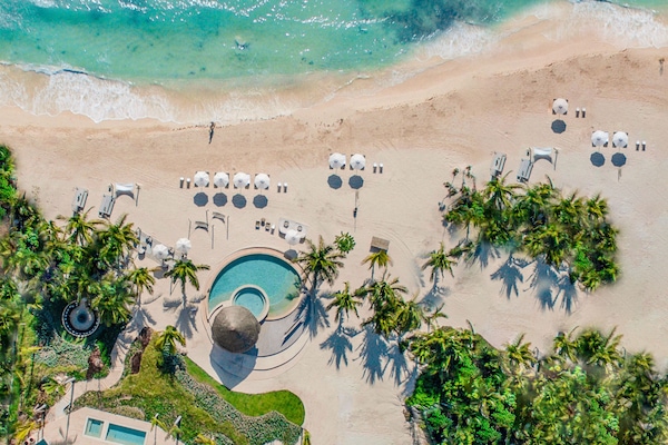 Private beach, white sand, sun loungers, beach umbrellas