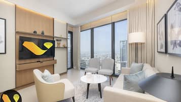 Apartamento elite | Área de estar | Smart TV 65 polegadas com canais a cabo