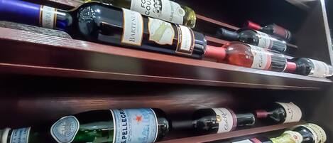 A wine rack with various bottles of wine.