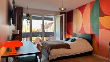 1 bedroom, desk, iron/ironing board, travel crib