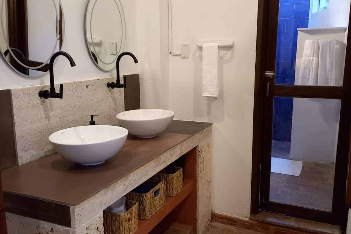 standard studio suite | bathroom | shower, rainfall showerhead, hair dryer, heated floors