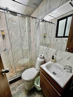 Shower, towels, soap, toilet paper