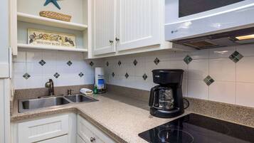 Fridge, microwave, stovetop, coffee/tea maker