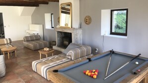 A cozy living room with a pool table, sofas, a fireplace, and a large mirror. - Large country house in a village in the Lubéron park, Forcalquier country (Limans)