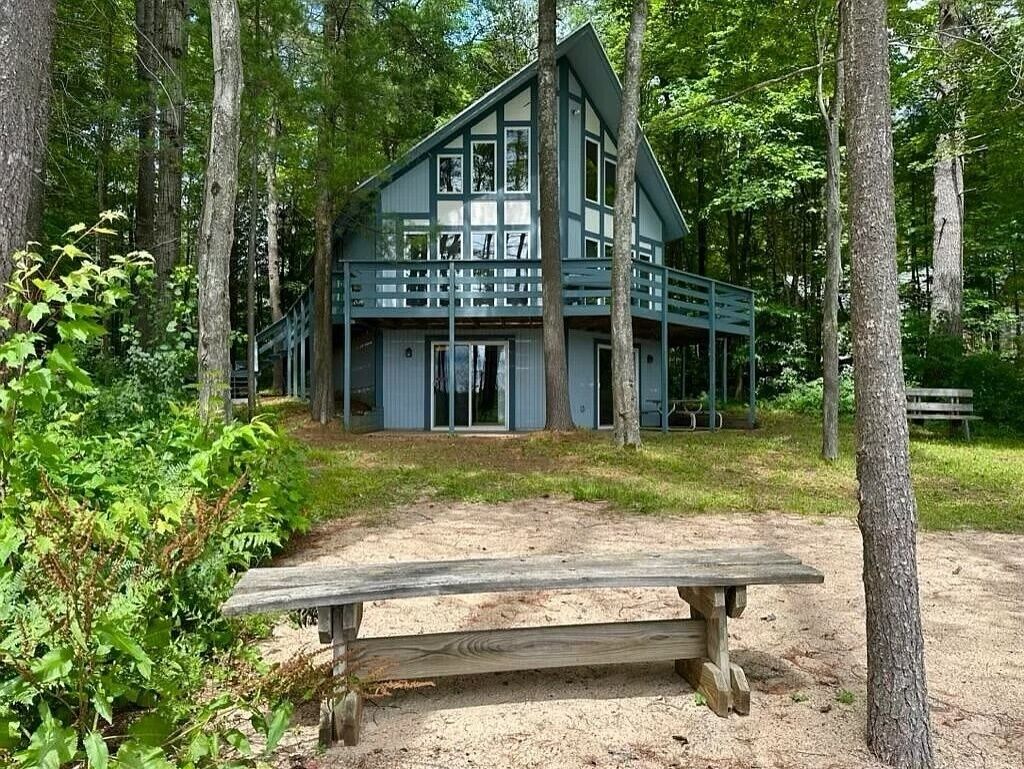 Cozy beachfront cottage in the woods with walkout basement and wrap-around porch
