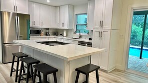 Fridge, microwave, stovetop, dishwasher - Darling Sunny's Cottage - Pup Friendly, Pool, Ground Level & Close to Restaurants & Shops (Sanibel)