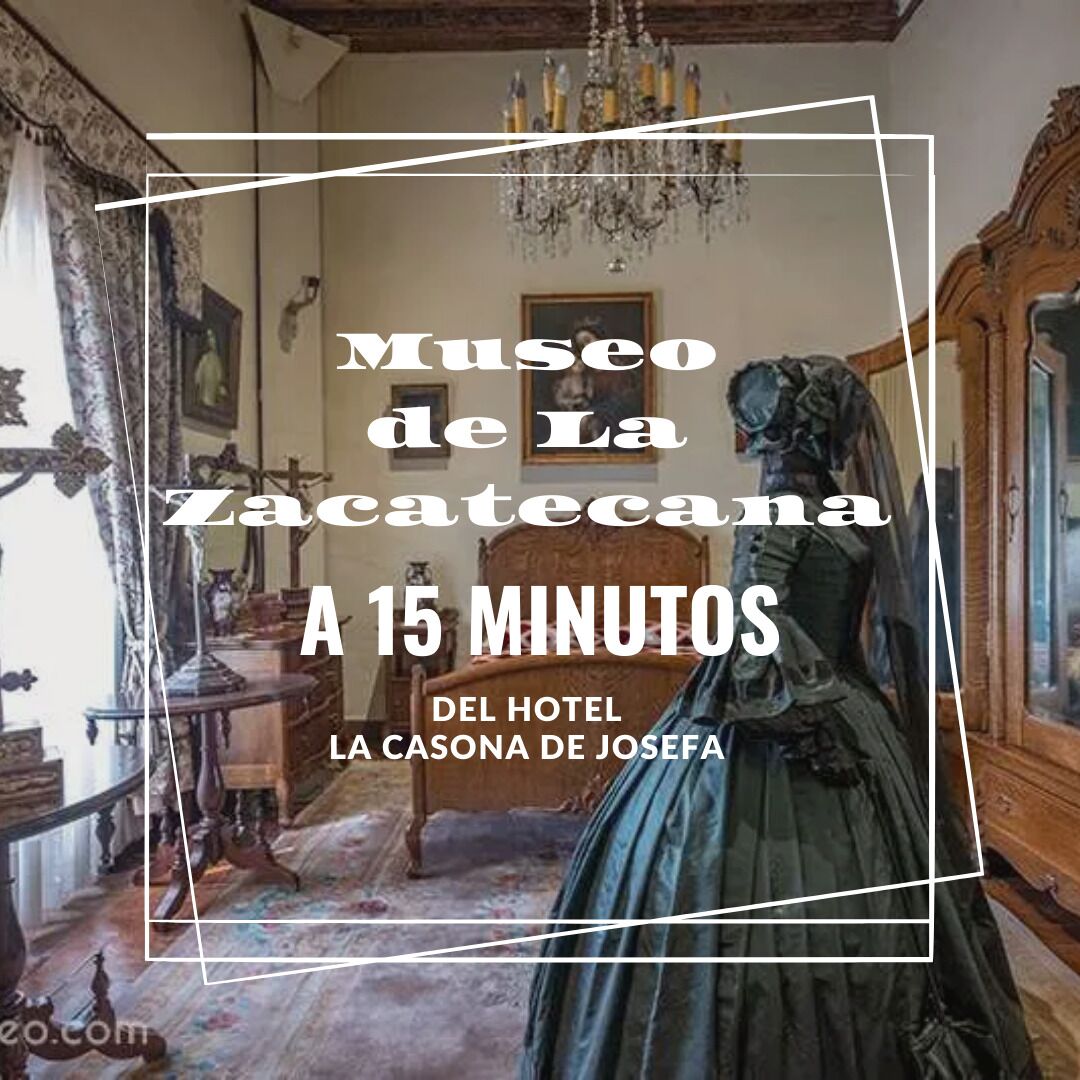 A room with a chandelier, a wooden bed, and a painting on the wall.