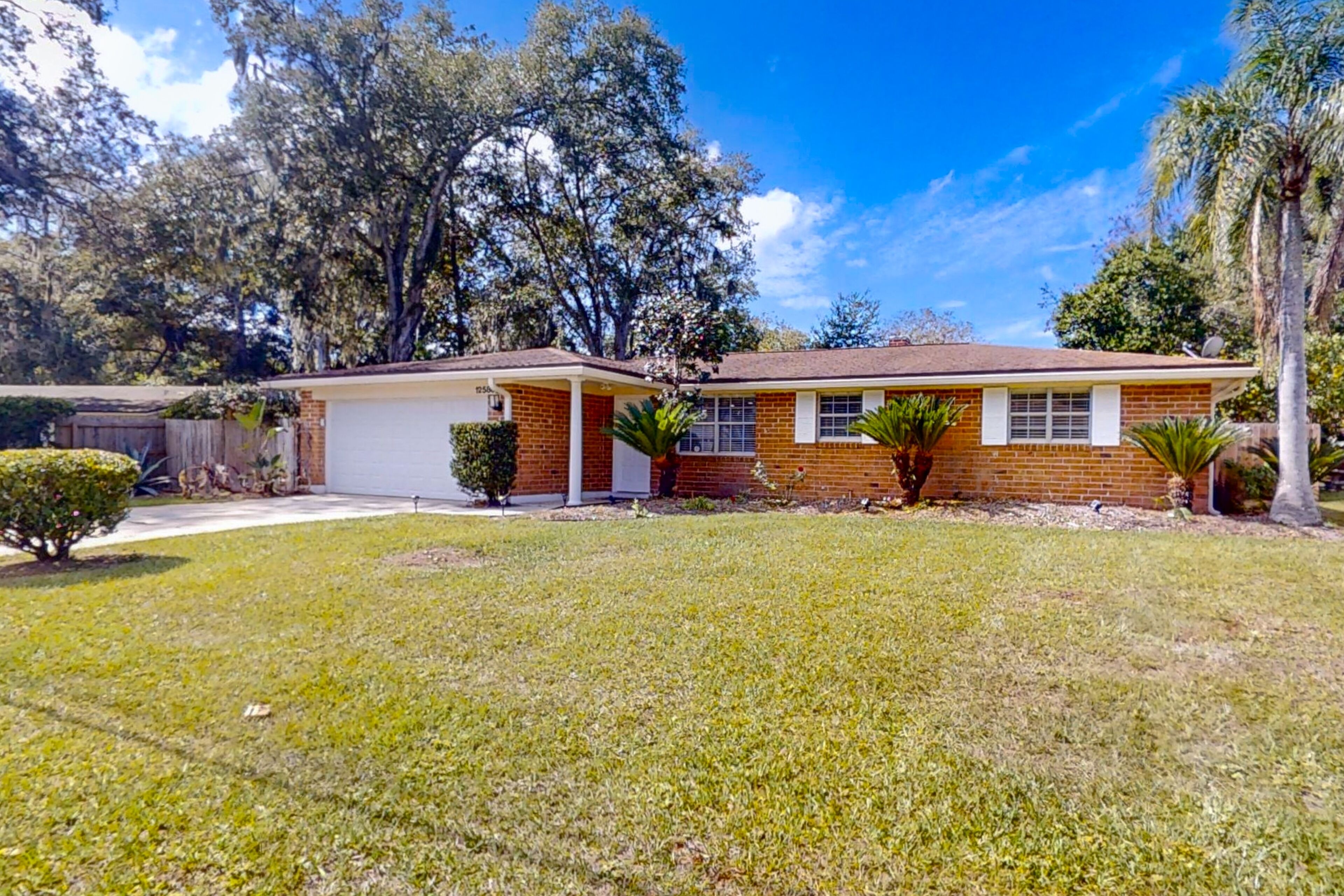 Updated dog-friendly home near water with private pool, patio, streaming, AC