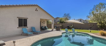 Airy desert home with an enclosed yard, private pool, hot tub, firepit, & W/D