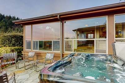 Oceanfront home with private hot tub, walls of glass & spectacular view