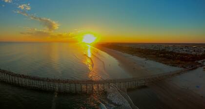 Beachside resort condo with screened balconies & golf