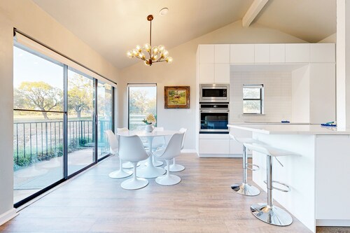 Dog-friendly waterfront retreat with a washer/dryer, furnished patio, & AC