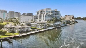 A waterfront hotel with a modern design, featuring a central courtyard, multiple balconies, and a view of the water. - Vistamar Waterfront Beach Abode -walk to the Beach (Fort Lauderdale)