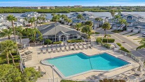 A resort with a swimming pool, palm trees, and waterfront views. - Spacious 2BR Siesta Key condo with beach access - GBB 1241 (Siesta Key)