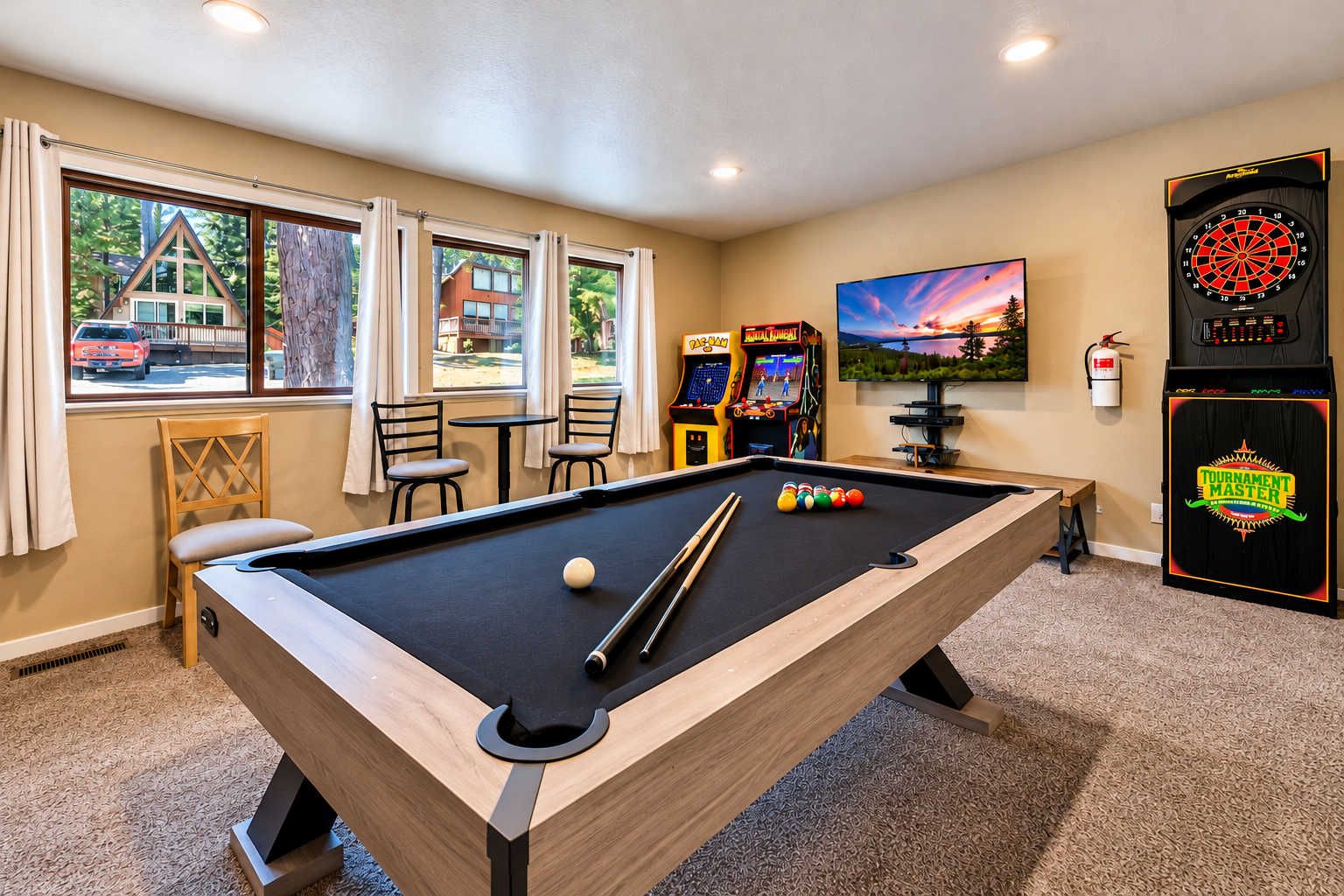 Your lower-level game room is built for fun with a pool table, two arcade games, dart board, TV, games, and a sleeper sofa. A dedicated hangout space means kids and adults can enjoy their own areas.