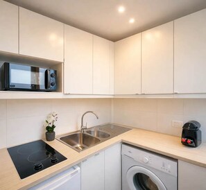 Fridge, microwave, stovetop, coffee/tea maker