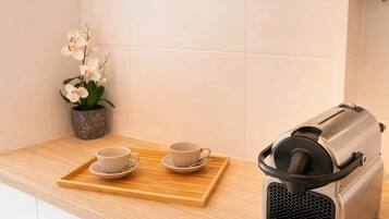 Fridge, microwave, stovetop, coffee/tea maker