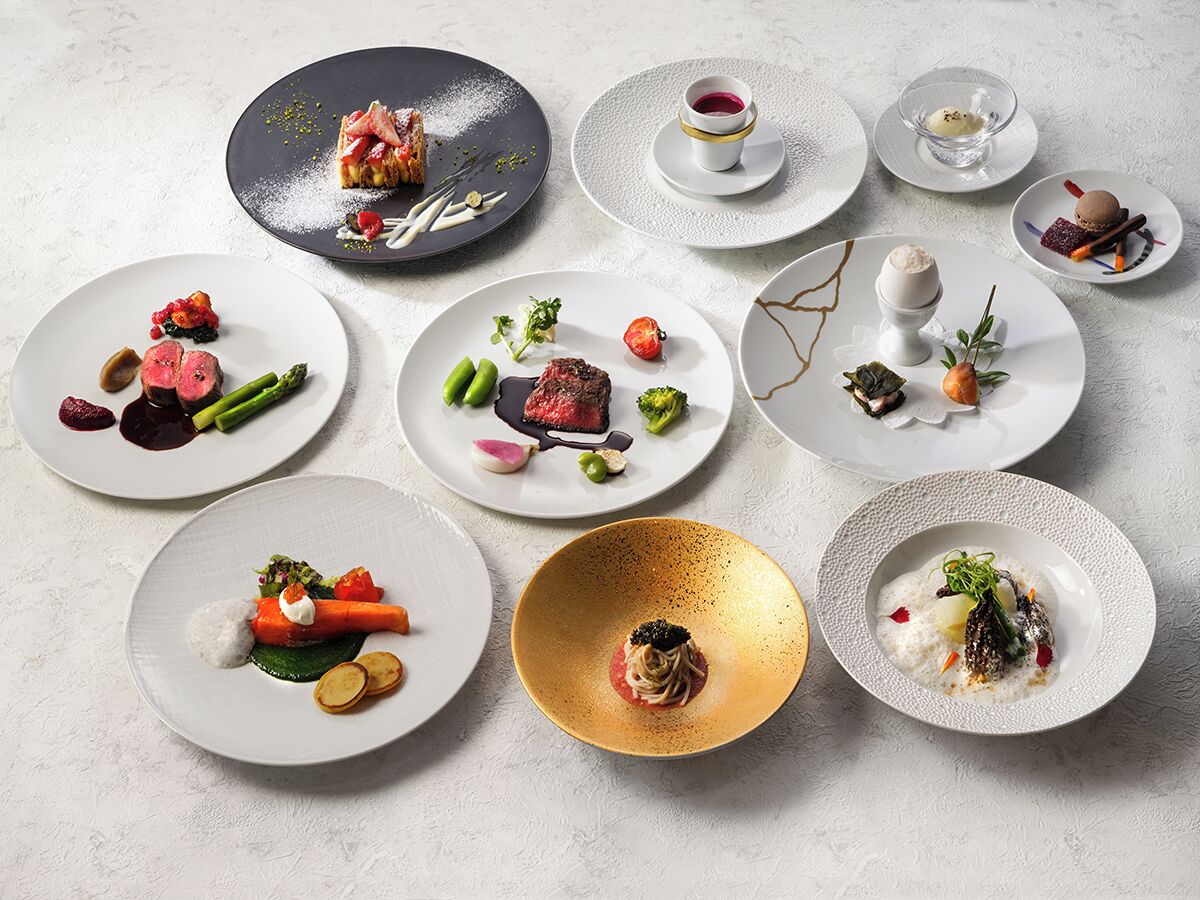 A variety of plated dishes arranged on a table.