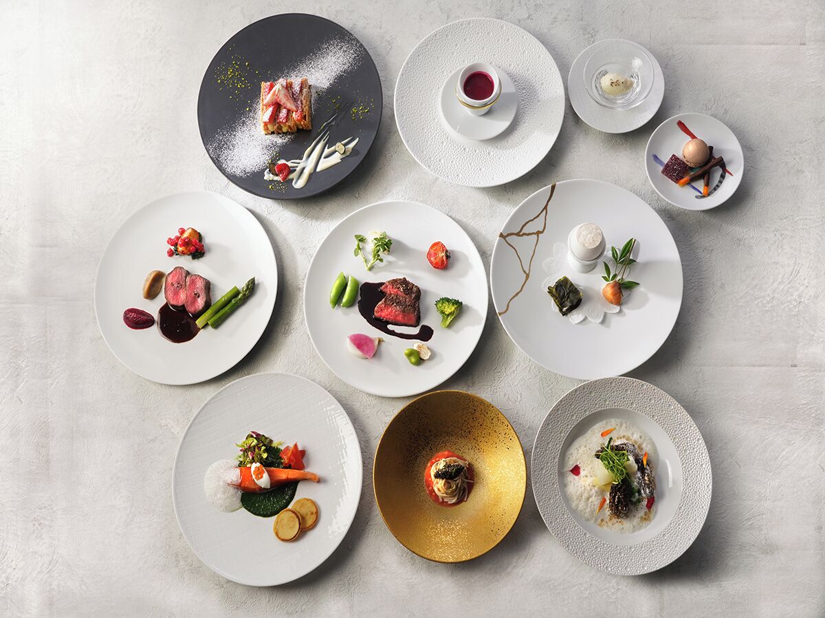 A variety of elegantly plated dishes arranged on a table.