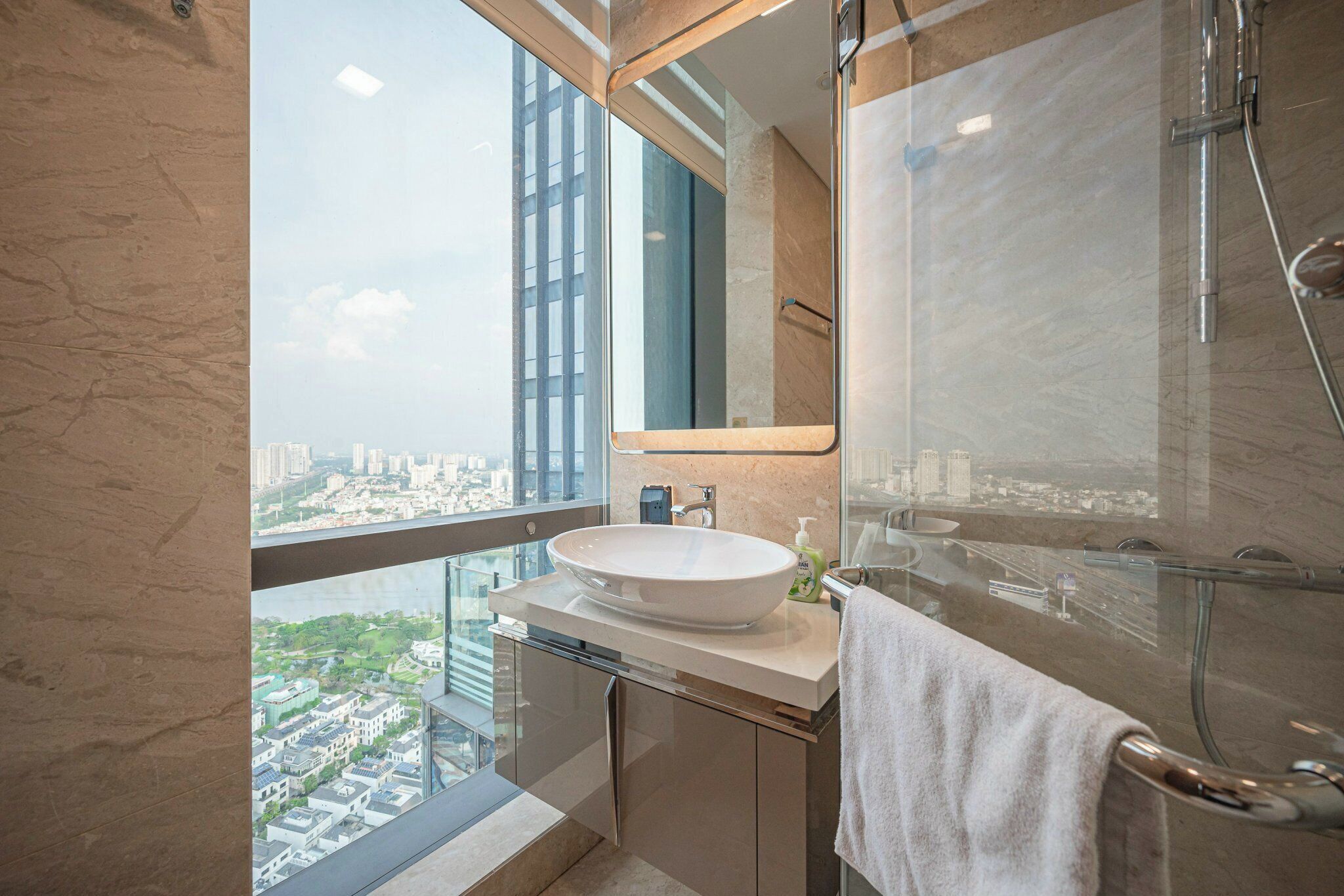 Separate bathtub and shower, towels