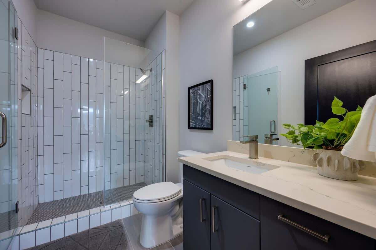 Shower, hair dryer, towels, shampoo