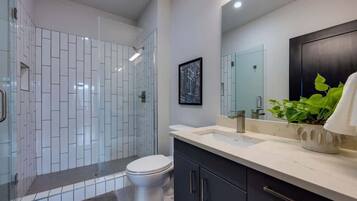 Shower, hair dryer, towels, shampoo
