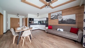 Apartament (A 11) | Zona de estar | Una televisión de pantalla plana