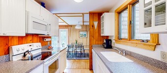 Dog-friendly ocean-view home with grill, wood stove, deck, washer/dryer, & AC