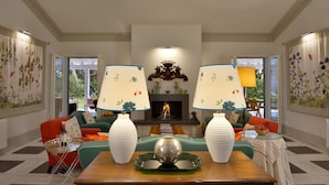 A living room with two sofas, a fireplace, and two lamps. - Villa Allegra - Homelike Villas (Bibbona)
