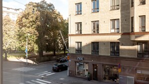 A multi-story building with a ground-level shop. - 2ndhomes Charming and Cozy 1BR Apartment (Helsinki)