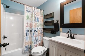 Shower, hair dryer, towels, shampoo