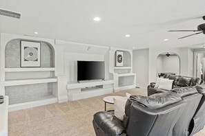 Smart TV, fireplace, table football, books