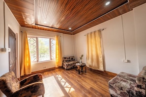 2nd and 3rd Floor Family Cottage | Living area | 30-inch TV with satellite channels