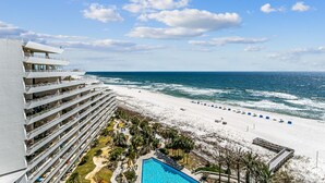 A hotel with multiple balconies overlooking a beach and ocean. - Eden W 902 Gulf Front Condo with Stunning Views! (Pensacola)