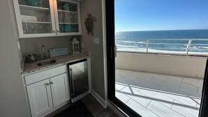 A kitchen with a view of the ocean. - Eden W 902 Gulf Front Condo with Stunning Views! (Pensacola)