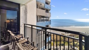 A balcony with a view of the beach and ocean. - 7th Floor Beachfront Getaway in Two Bedroom Bliss (Myrtle Beach)