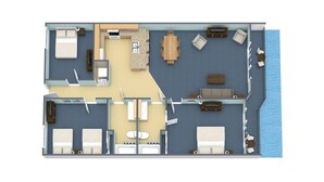 Ein Hotelzimmer mit Bett, zwei Nachttischen, einem Schreibtisch, einem Sessel und Meerblick. Außerdem ist ein kleines Badezimmer vorhanden.
