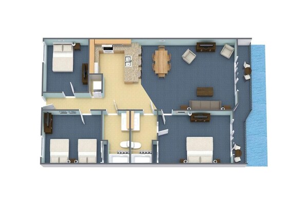 Un plan d’une chambre d’hôtel comprenant un lit, deux tables de chevet, un bureau, une chaise, une petite salle de bain et une vue sur la mer.