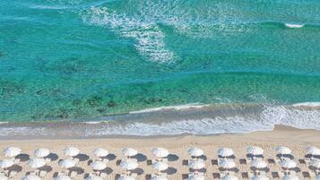 Private beach, white sand, sun-loungers, beach umbrellas