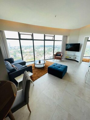 Business Apartment | Living area | 24-inch Smart TV with digital channels - Lux Suites Le marc Luxury Apartments (Nairobi)