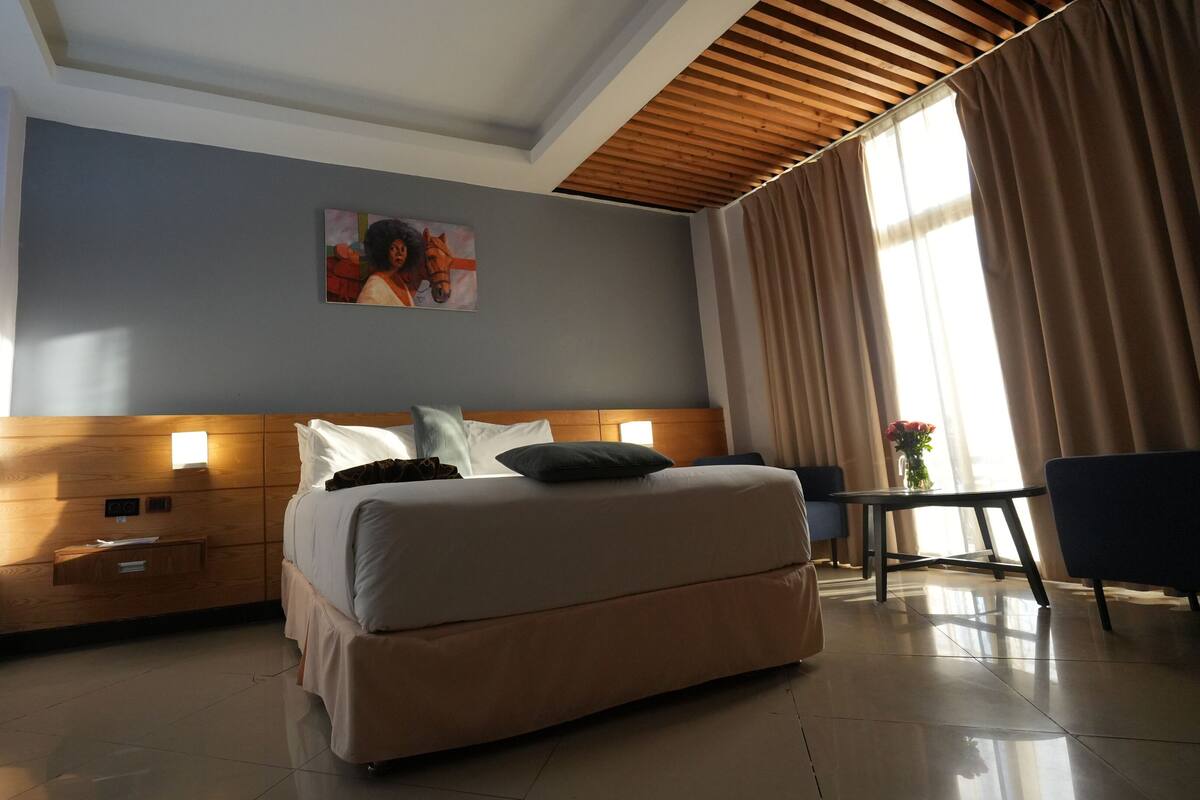 Hypo-allergenic bedding, down comforters, pillowtop beds, in-room safe