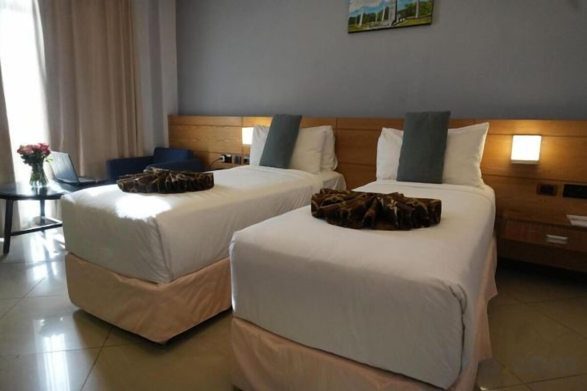 Hypo-allergenic bedding, down duvets, pillow-top beds, in-room safe