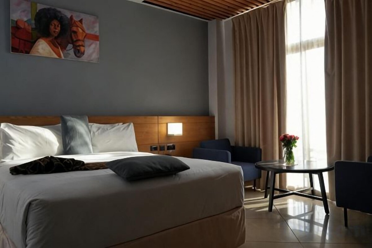 Hypo-allergenic bedding, down duvets, pillow-top beds, in-room safe