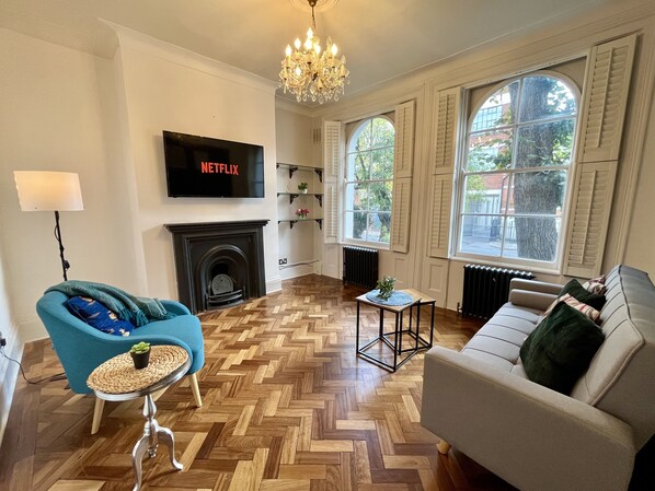 Relax in style with a large flat-screen TV, cozy fireplace, and comfortable seating areas.
