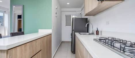 Fridge, microwave, stovetop, coffee/tea maker