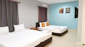 A hotel room with two beds, a flat-screen TV mounted on the wall, and a small table between the beds. - Sunrise Resort (Bang Saphan)