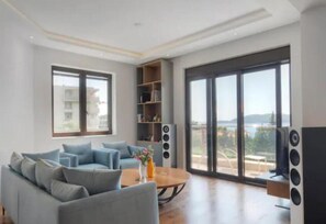 Comfort Apartment | Living area | 32-inch LCD TV with cable channels - Regina's Residence-One Bedroom Apartment (Pržno)
